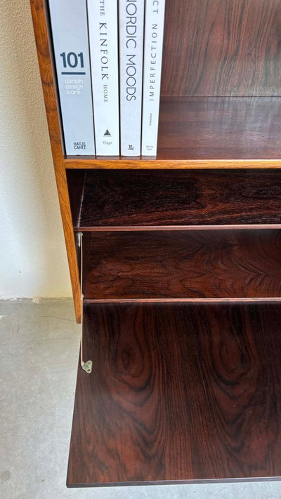 
                  
                    Boekenkast klapdeur palissander - LOUI.STORE
                  
                