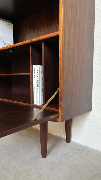 
                  
                    Boekenkast klapdeur palissander - LOUI.STORE
                  
                