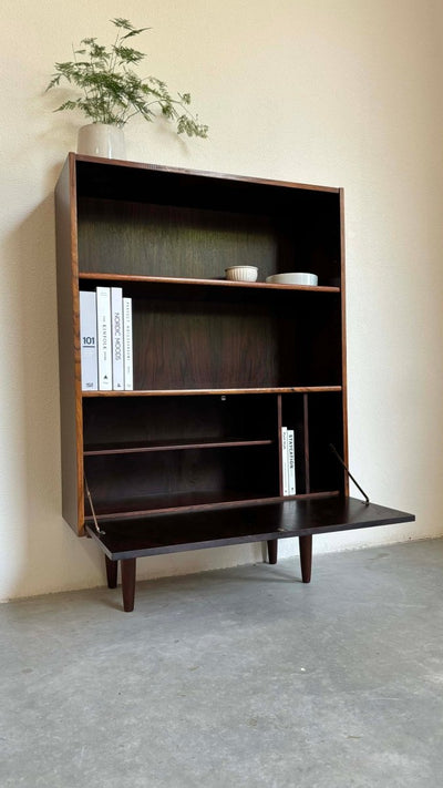 
                  
                    Boekenkast klapdeur palissander - LOUI.STORE
                  
                