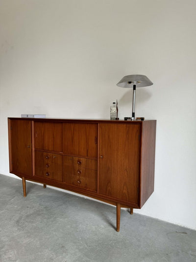 
                  
                    Highboard teak veel vakken - LOUI.STORE
                  
                