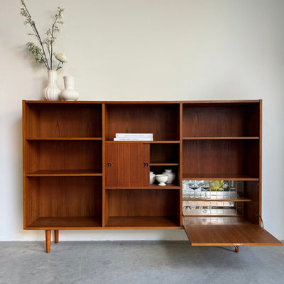 
                  
                    Vintage boekenkast XL teak met klep - LOUI.STORE
                  
                