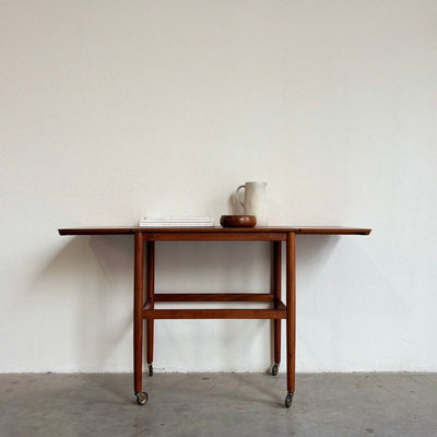 
                  
                    Vintage verlengbare trolley - bijzettafel teak - LOUI.STORE
                  
                